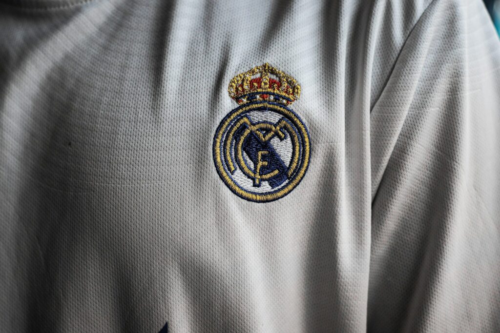 a close up of a soccer jersey with a crown on it